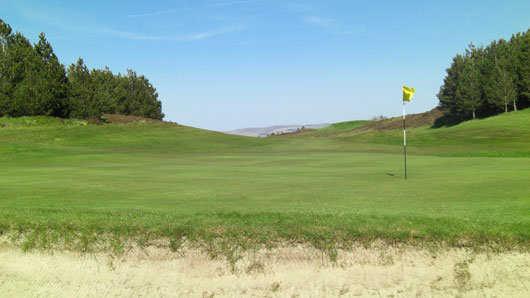 A view of hole #3 guarded by sand trap at Port Glasgow Golf Club