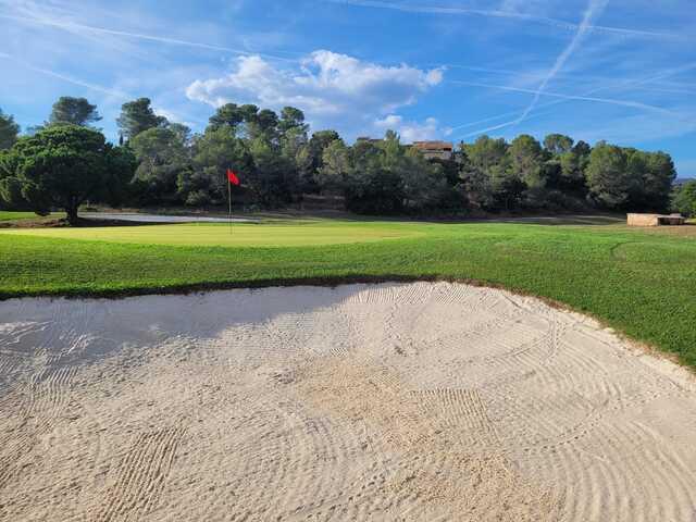 View from a bunker near a green from Academy Golf at Esterel Golf Club.