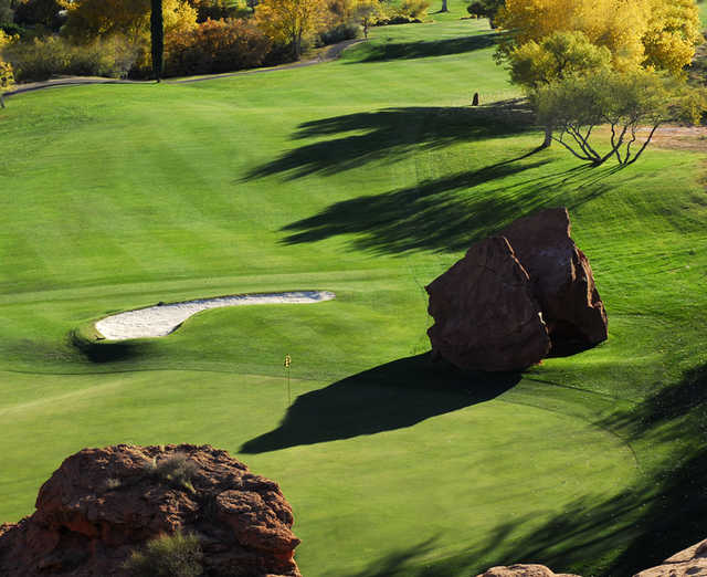 A view of green #7 protected by rocks and bunker at Dixie Red Hills Golf Course