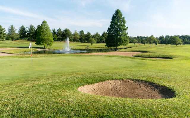 A view of a hole with water and bunkers coming into play from Covered Bridge Golf Club .