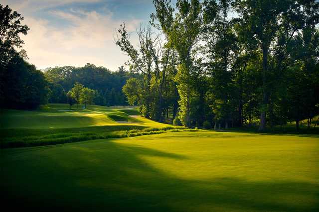A sunny day view of a hole at Woodland Country Club