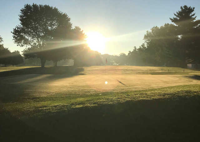 A sunny day view of a green at Maxwelton Golf Club.