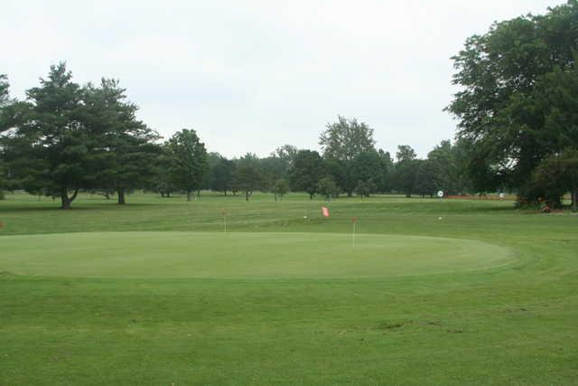 A view of a fairway and the putting green in foreground at McMillen Park Golf Course.