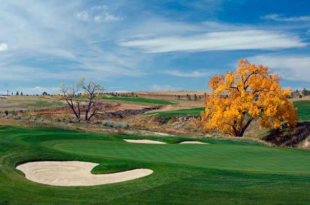 A view of a hole protected by bunkers on both sides of the green at Blackstone Country Club