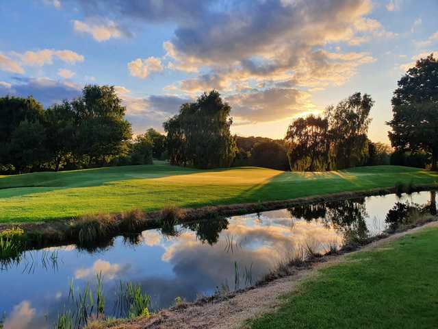 A sunset view of a green at Shropshire Golf Centre.