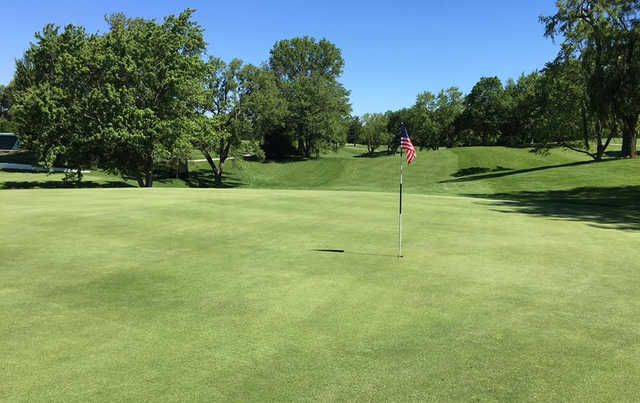 A sunny day view of a hole at Meshingomesia Country Club.