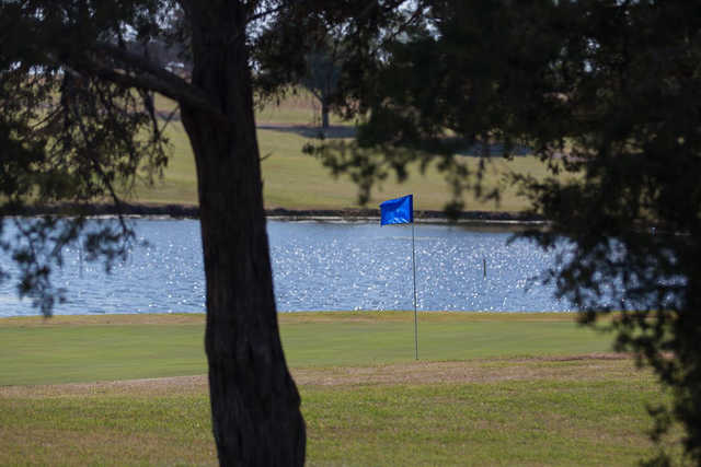 A view of the 17th green with water in background at Broadmoore Golf Course