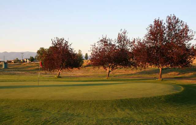 A sunset view of a hole at Old Baldy Golf Course.