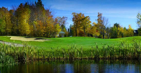 A fall view over the water of green at Mount Snow Golf Club