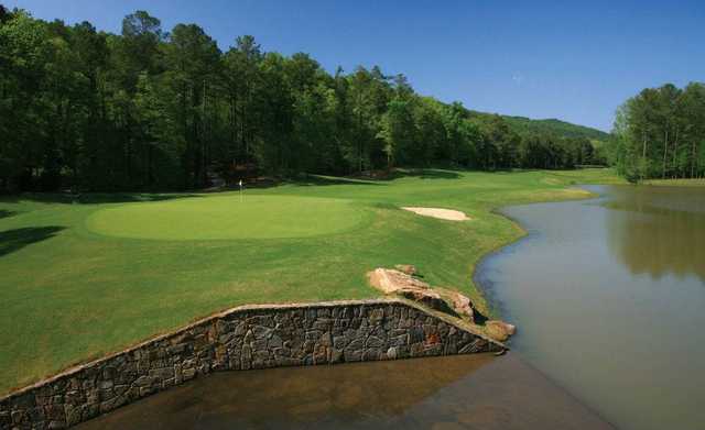 A view of the 9th hole surrounded by water at Limestone Springs Golf Club.