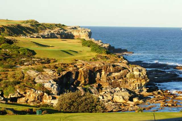 A view of the 14th hole high above Little Bay at Coast Golf & Recreation Club