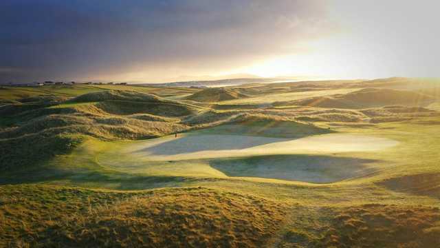 A sunny day view of a green at Carne Golf Links.