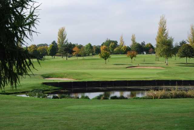 A view over the pond of a green at Taunton Vale Golf Club