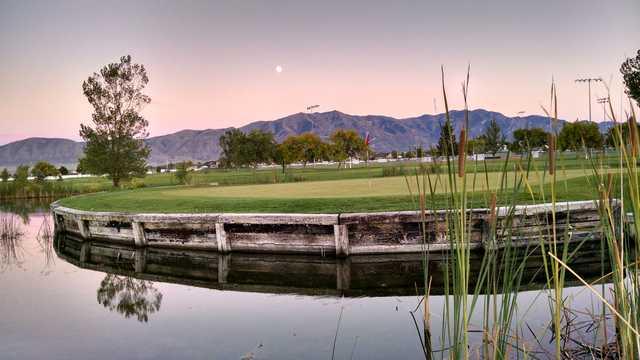 A view of a green surrounded by water at Skyway Golf Course.
