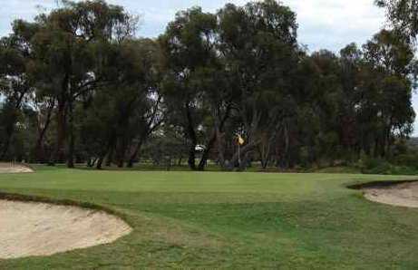 A view of green protected by bunkers at Churchill Park Golf Club