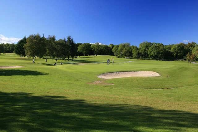 A view of a green protected by bunkers at Oughterard Golf Club