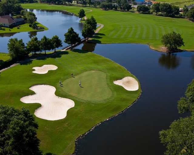 A view of a green protected by three bunkers at Craft Farms Resort