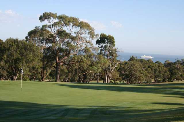 A sunny day view of a green at Bay Views Golf Course