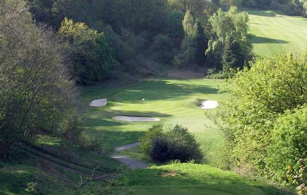 A view of green #10 guarded by sand traps at Murrayfield Golf Club