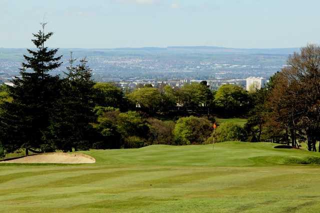 A view of green guarded by bunker at Airdrie Golf Club