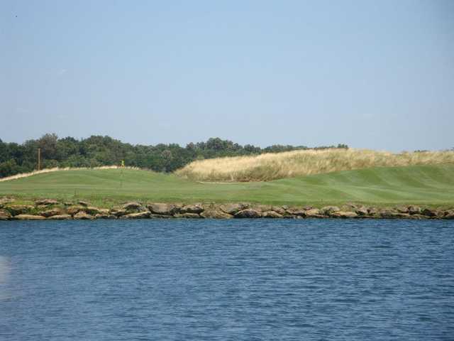 A view over the water of a hole at Cambridge Golf Club